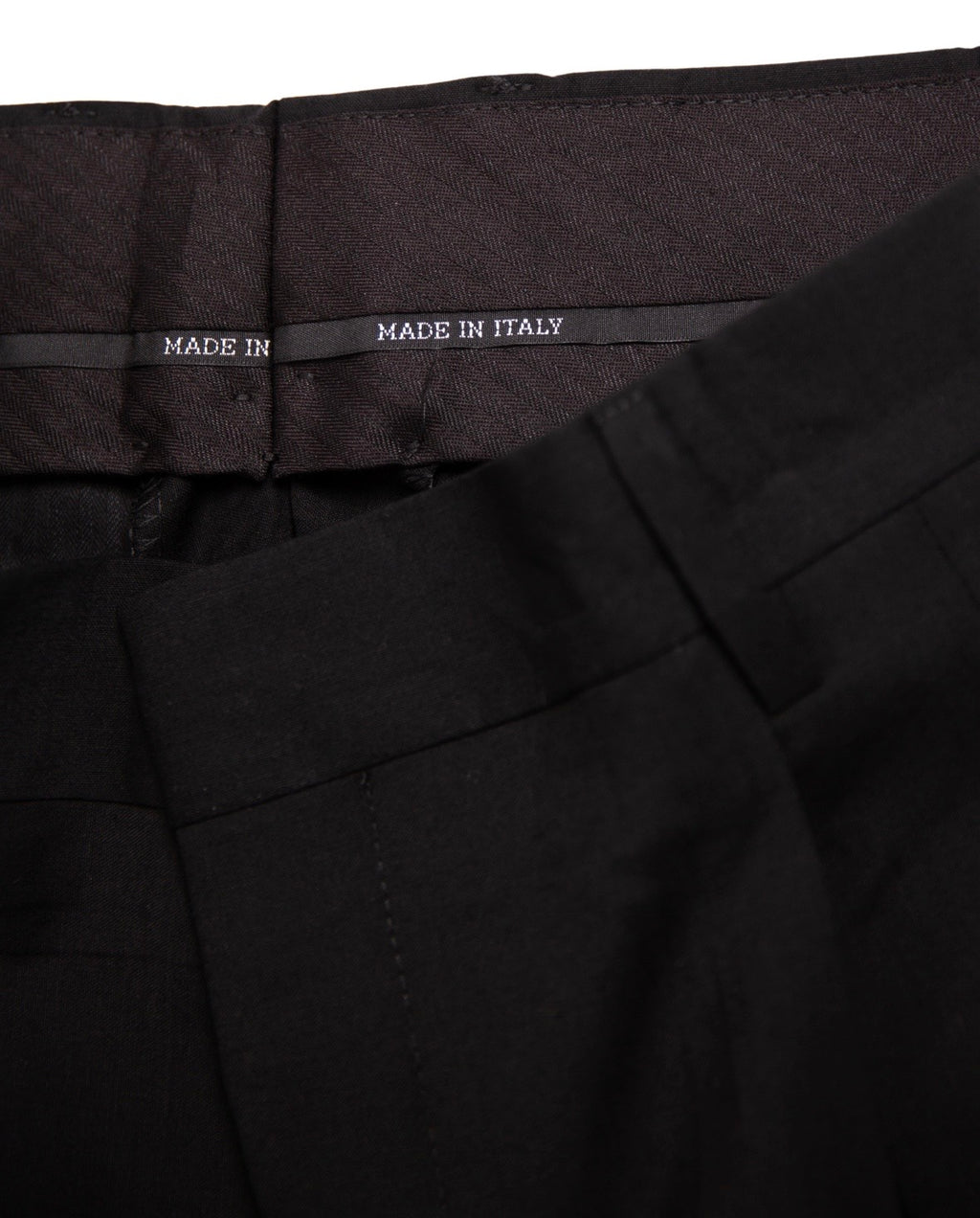 Black pants with 'Made in Italy' label on waistband