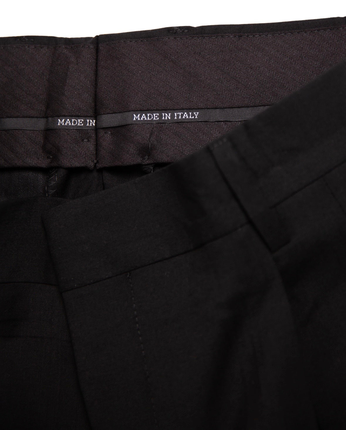 Black pants with 'Made in Italy' label on waistband