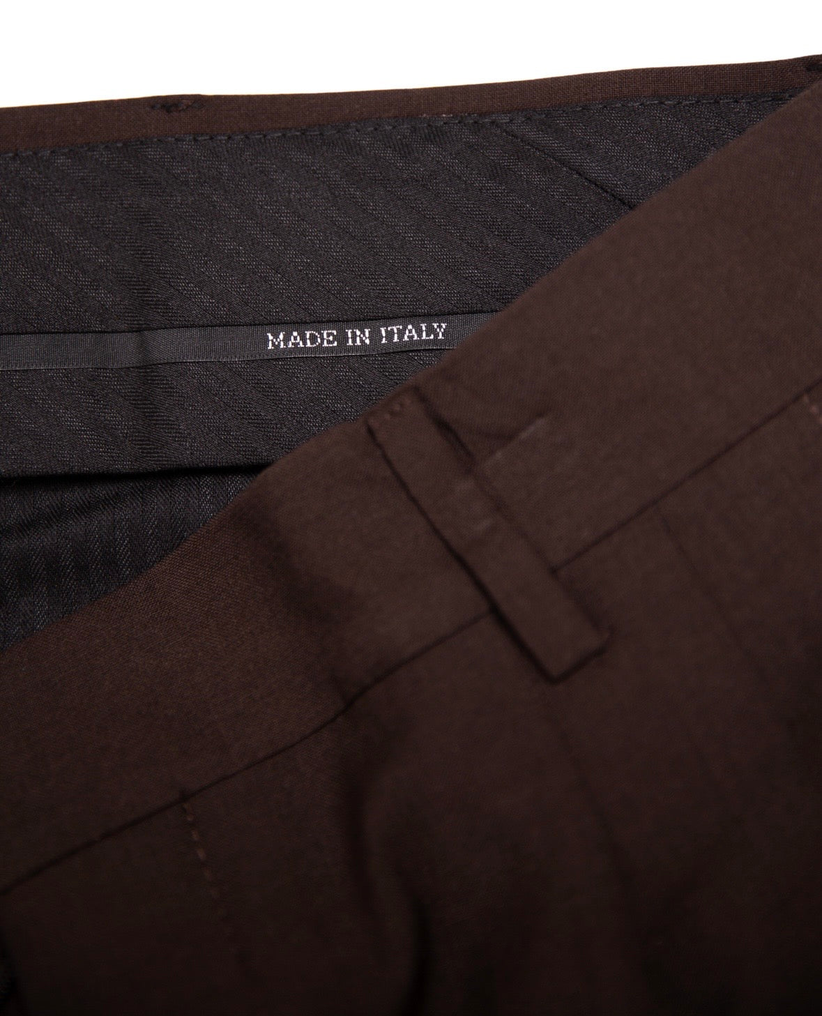 Brown fabric with 'Made in Italy' label on a white background