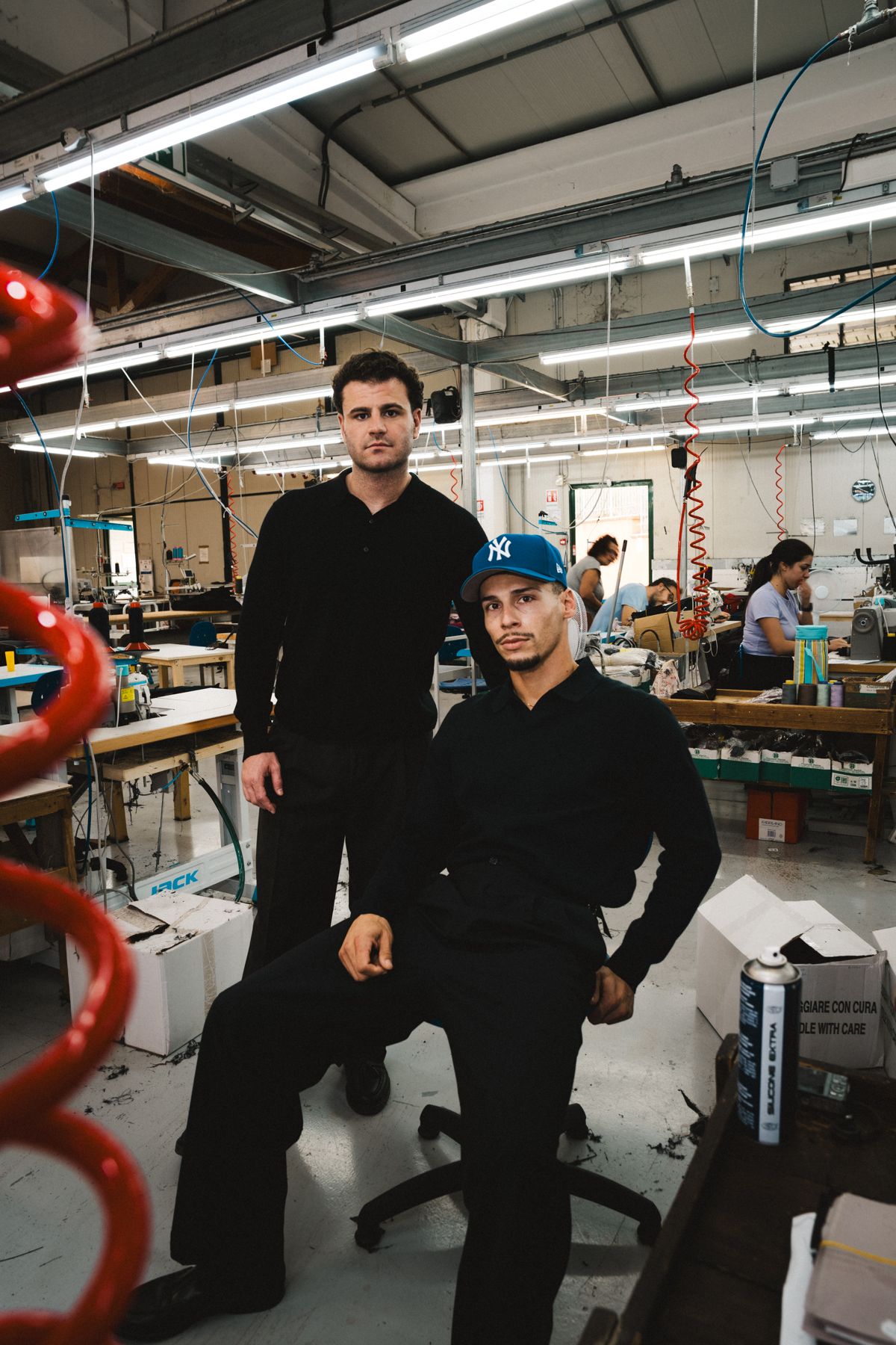 The founders on the factory floor in Italy